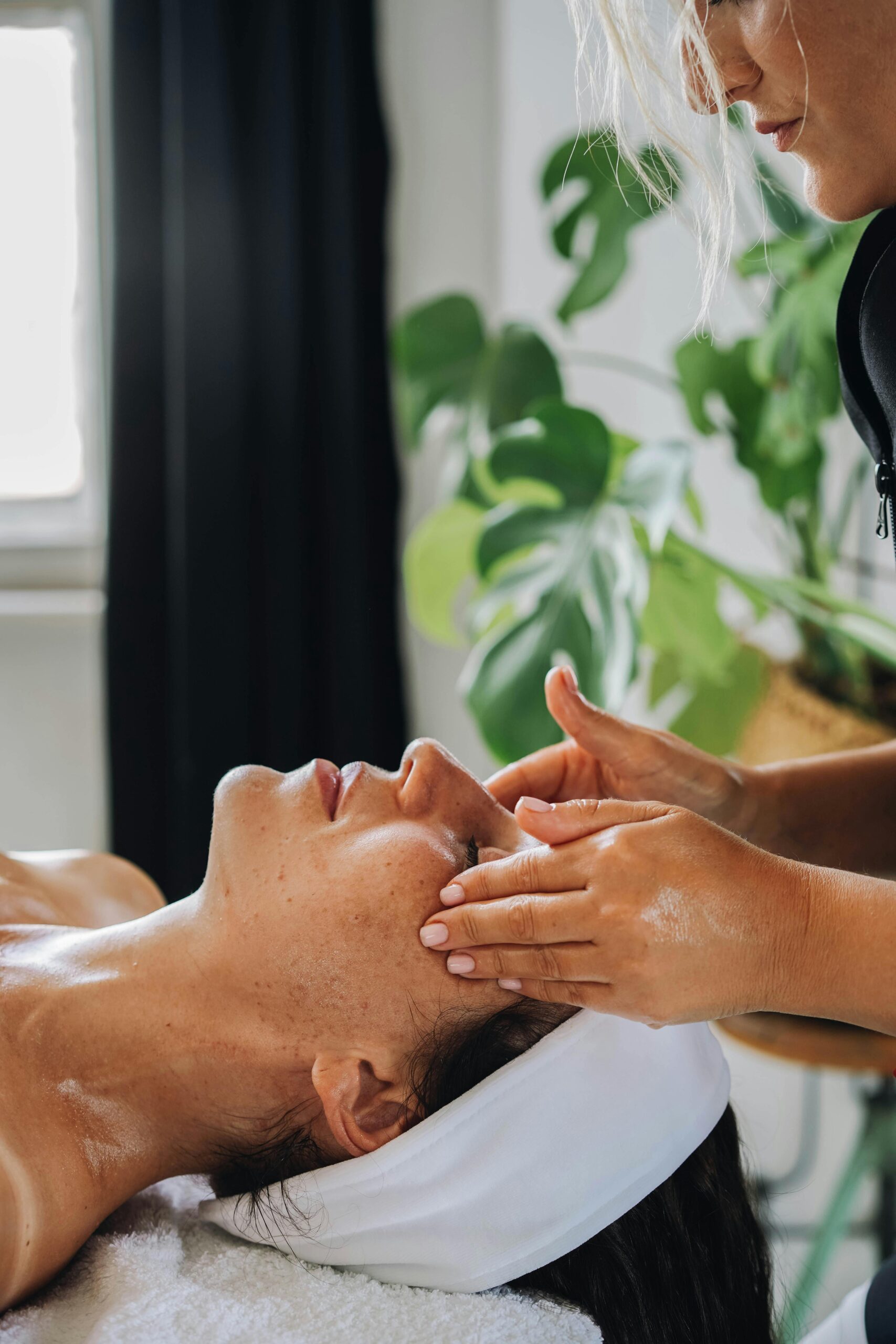 Woman receiving a facial treatment.